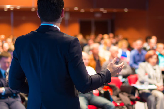 Speaker presenting at business seminar