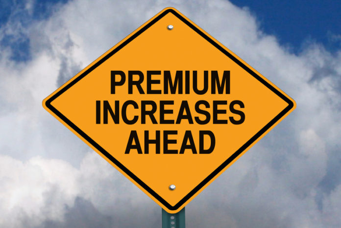 premium increases ahead roadsign