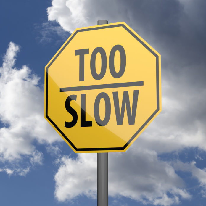 Road sign Yellow with words Too Slow