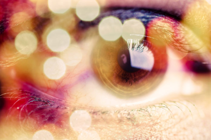 Double exposure of an eye with bokeh
