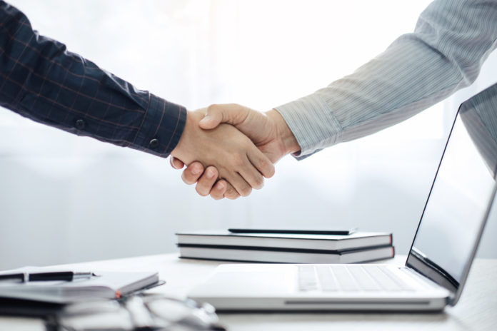 Business partnership meeting concept, Two confident Business handshake and business people after discussing good deal of Trading contract and new projects for both companies, success, partnership
