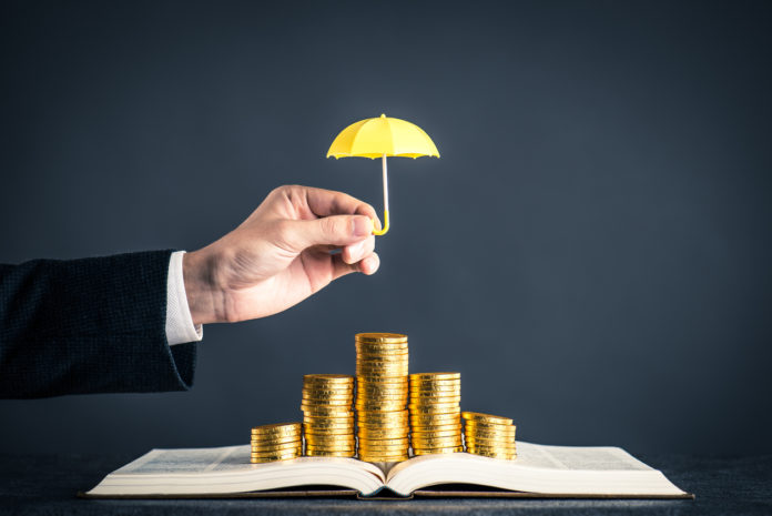 umbrella protecting gold coins