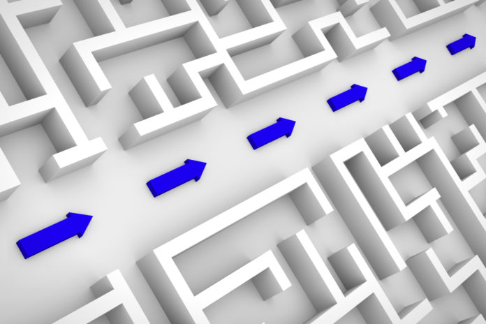white maze structure, blue arrows showing shortcut through labyrinth