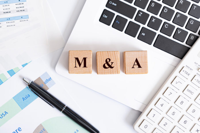 M&A word made with building blocks