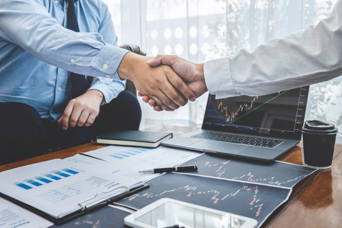 Businessman shaking hands after conversation, Finishing up a collaboration discussing of partner cooperation in investment marketing project and successful contract agreement to become teamwork