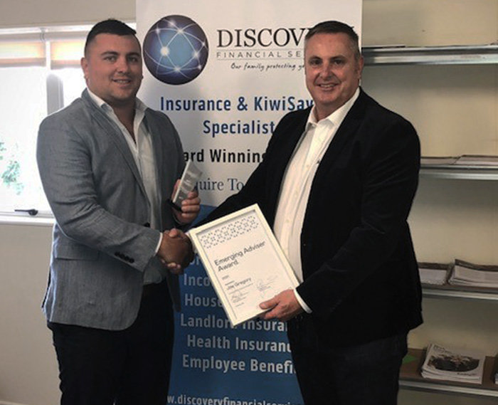 Joey Gregory, Discovery Financial receives the Emerging Adviser of the Year award from Mike Whitehead, Business Manager, Fidelity Life.
