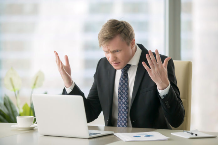Puzzled businessman in office