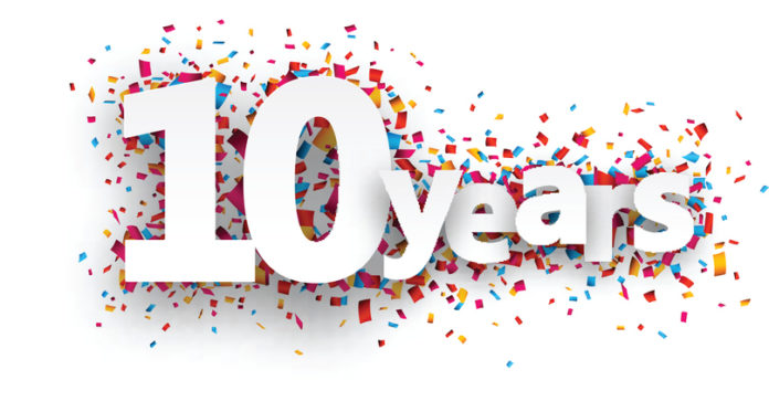 Ten years paper confetti sign