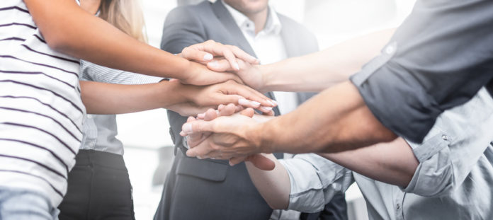 Stack of hands. Unity and teamwork concept.