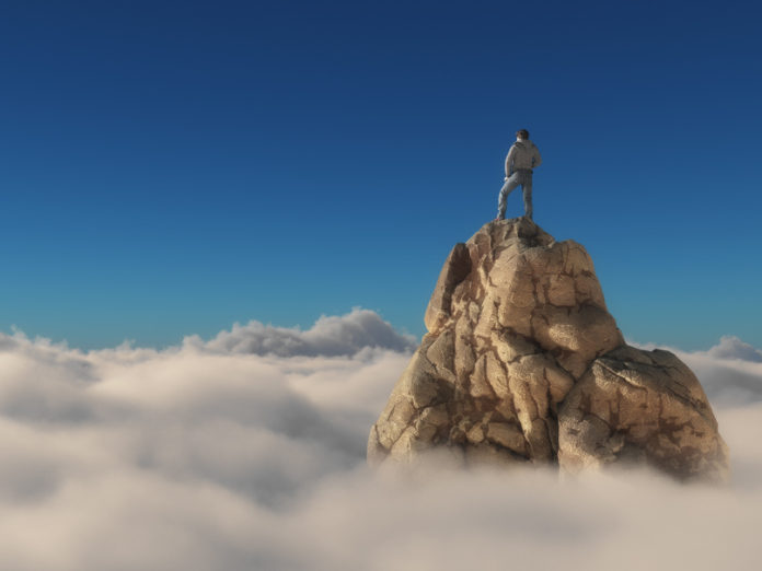 Man standing on a stone cliff