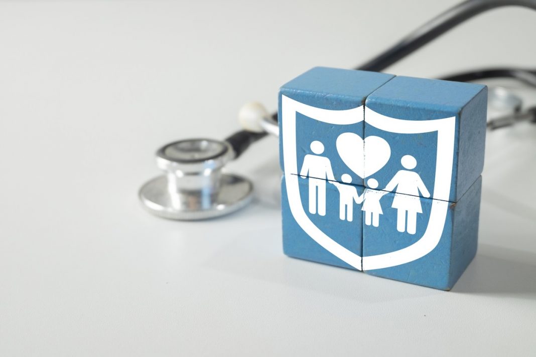 Family Health Insurance and Medical Protection Concept. Stethoscope nearby.